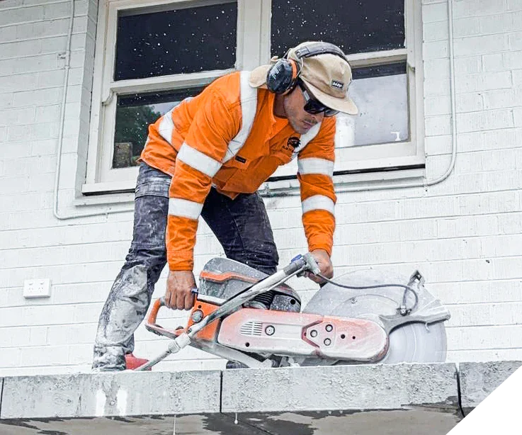 A Slice It Right staff working on concrete floor removal in a Perth home.