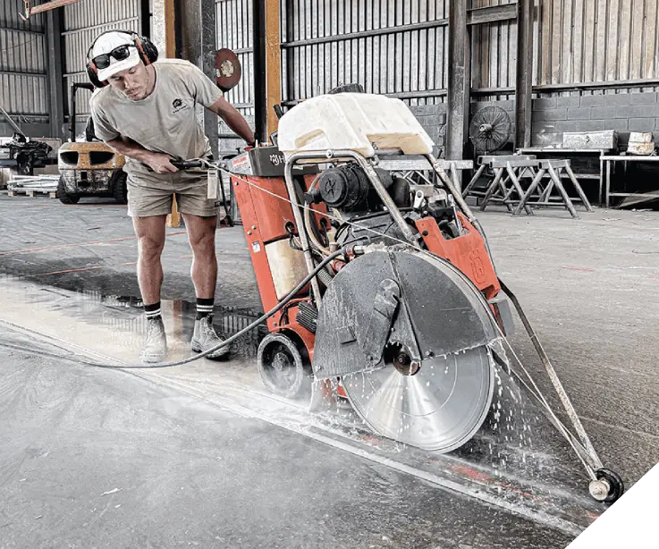 Slice It Right staff working on concrete floor sawing in a Perth commercial building.